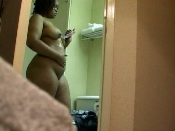 BBW ebony girl applying lotion to her big tits and naked body